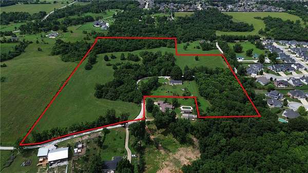 23.4 Acres of Land with Home for Sale in Cave Springs, Arkansas