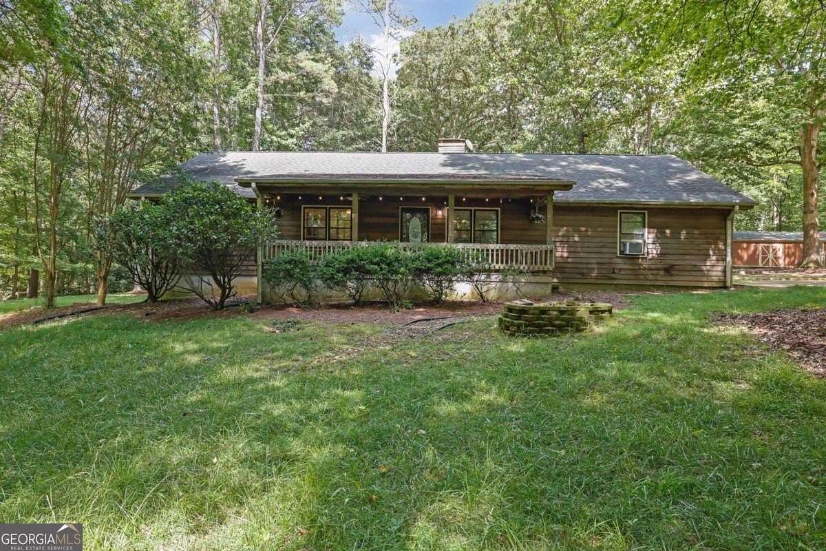 5.6 Acres of Land with Home for Sale in Cumming, Georgia