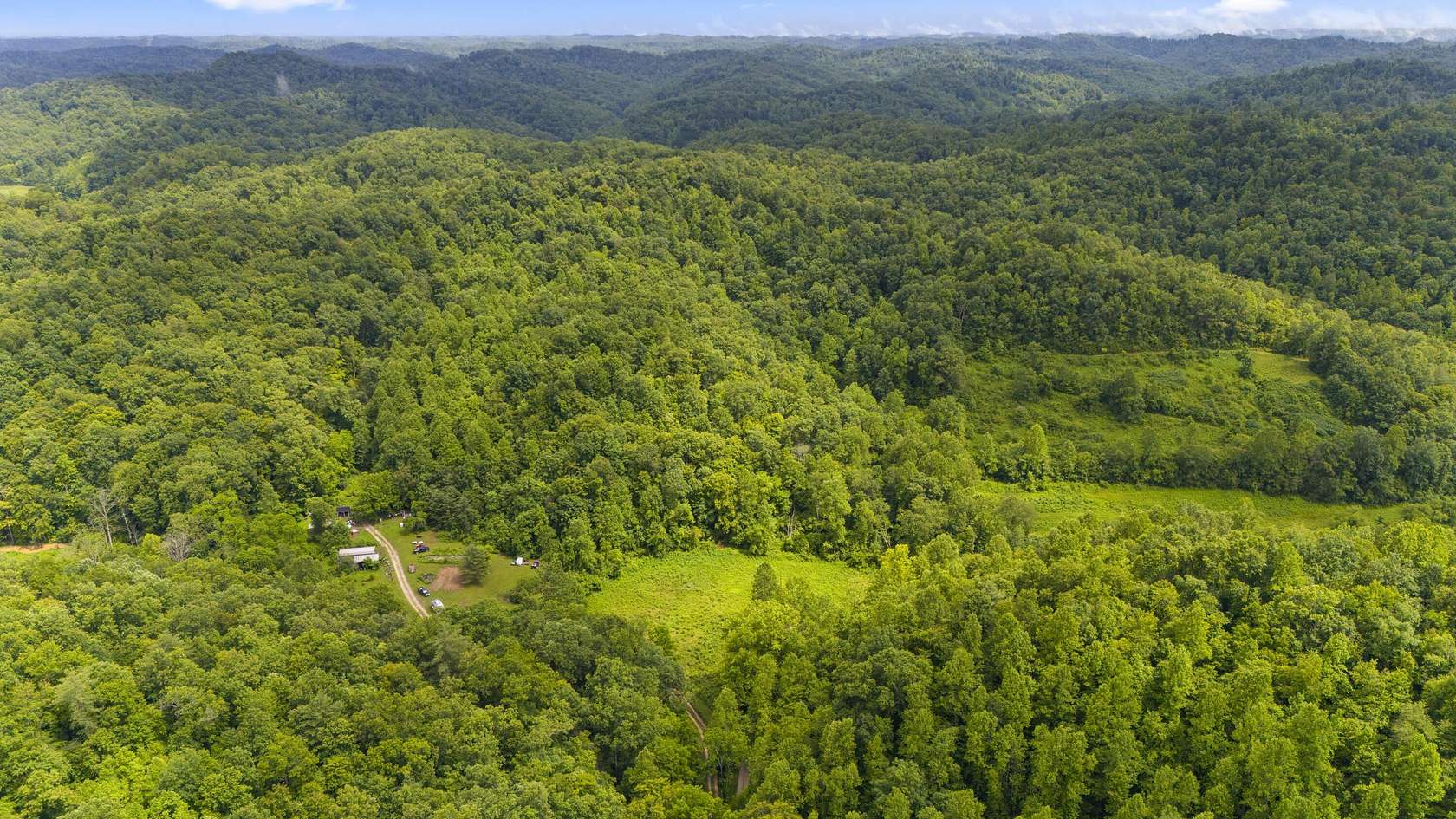 18.5 Acres of Land with Home for Sale in Campton, Kentucky