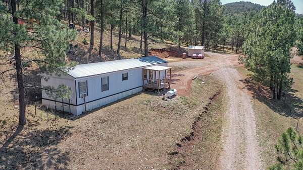 5.28 Acres of Residential Land with Home for Sale in Cloudcroft, New Mexico