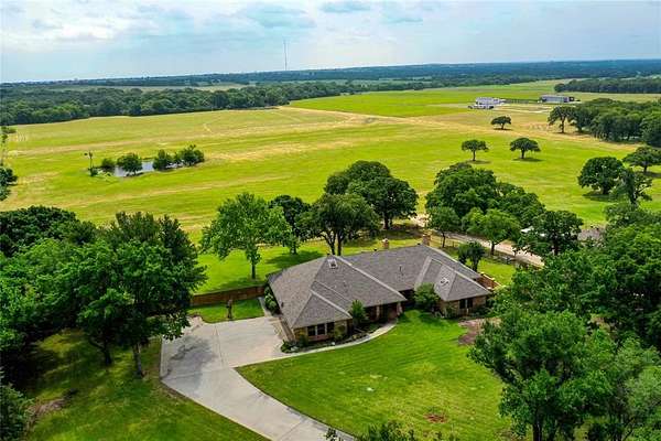 84.8 Acres of Agricultural Land with Home for Sale in Decatur, Texas