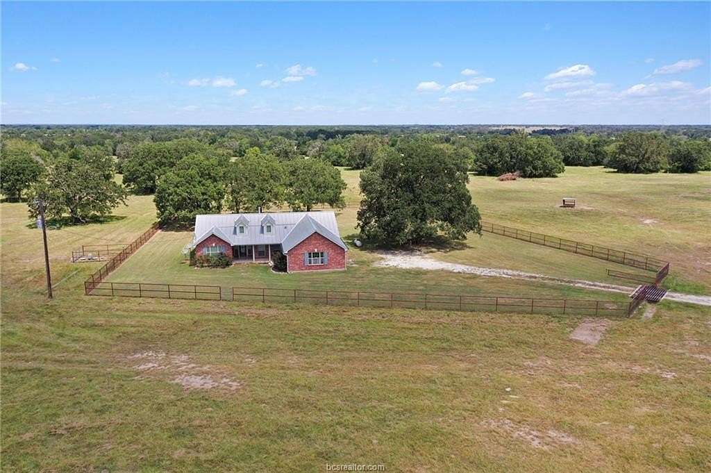 25.7 Acres of Agricultural Land with Home for Sale in Madisonville, Texas