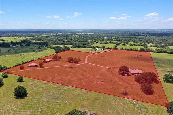 25.7 Acres of Agricultural Land with Home for Sale in Madisonville, Texas