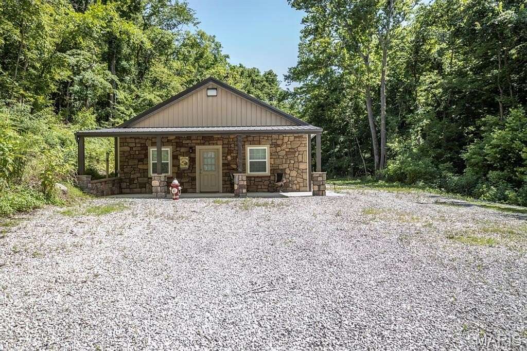 128 Acres of Recreational Land with Home for Sale in Waynesville, Missouri