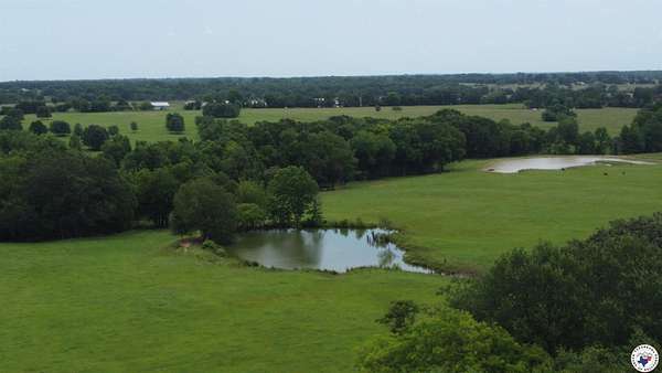 80 Acres of Land with Home for Sale in De Kalb, Texas