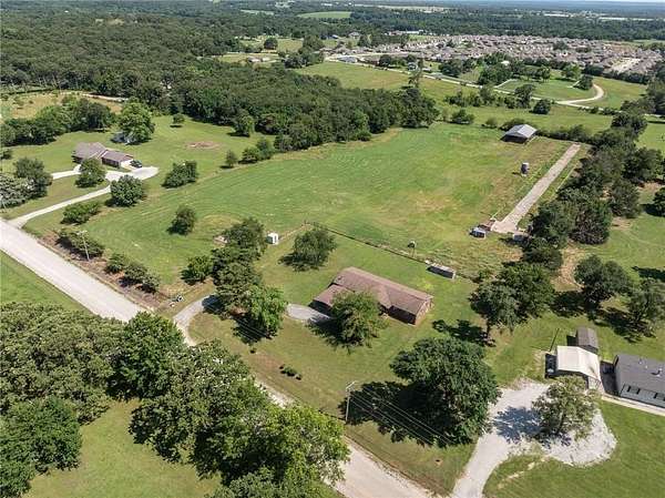 7.47 Acres of Land with Home for Sale in Gentry, Arkansas