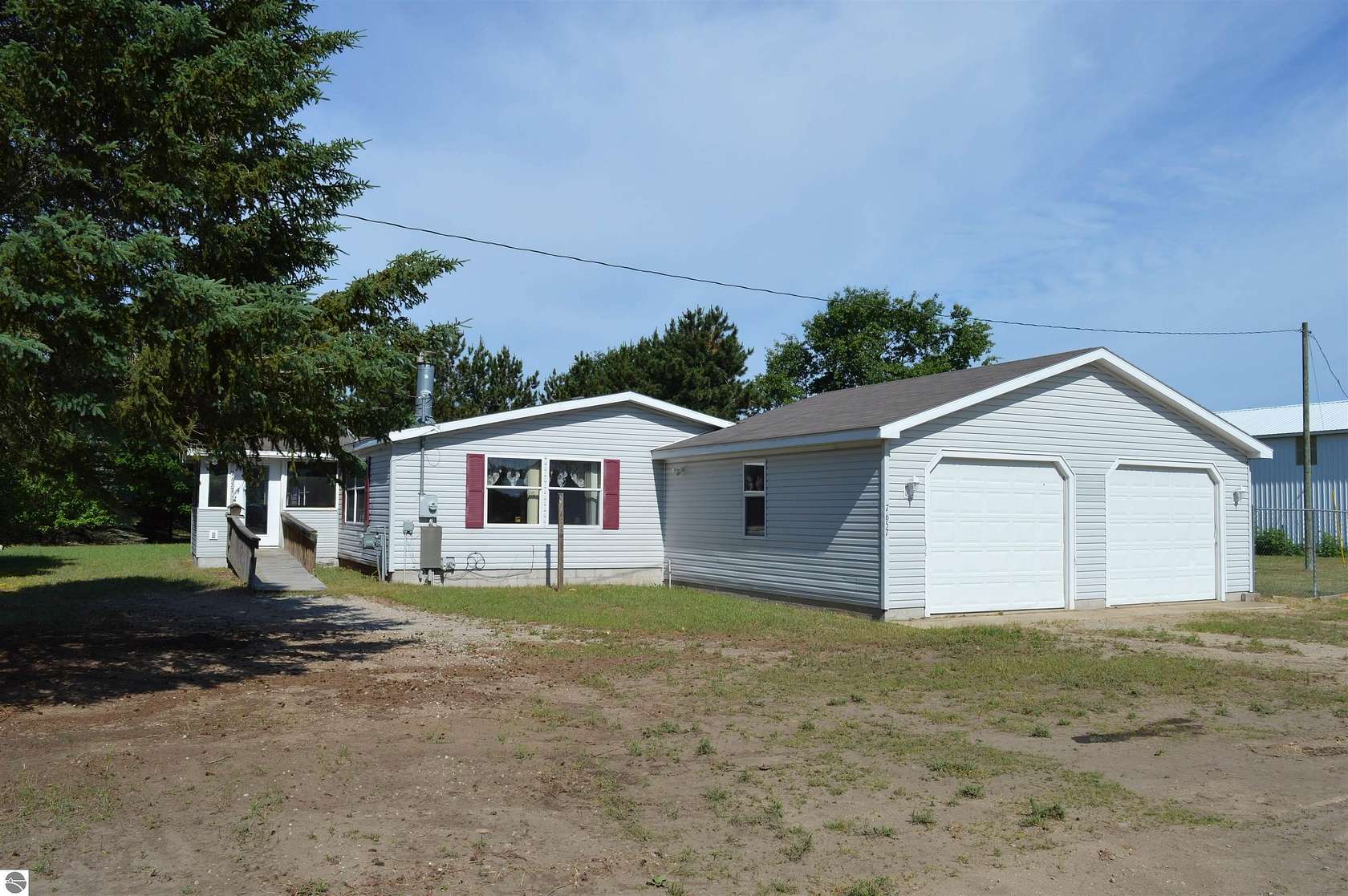 3 Acres of Residential Land with Home for Sale in Rapid City, Michigan