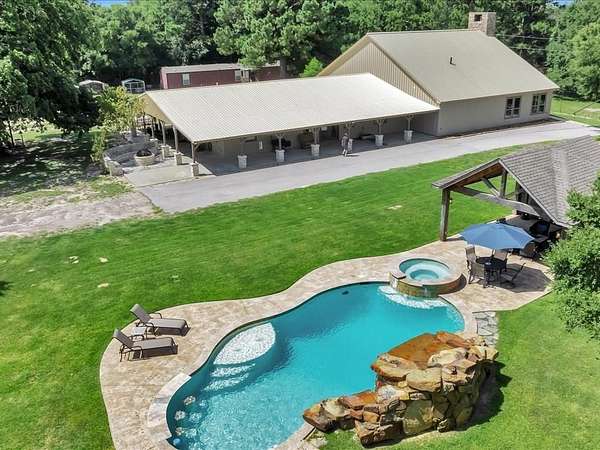 142 Acres of Land with Home for Sale in Bedias, Texas