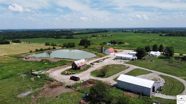 100 Acres of Agricultural Land with Home for Sale in Centerview, Missouri