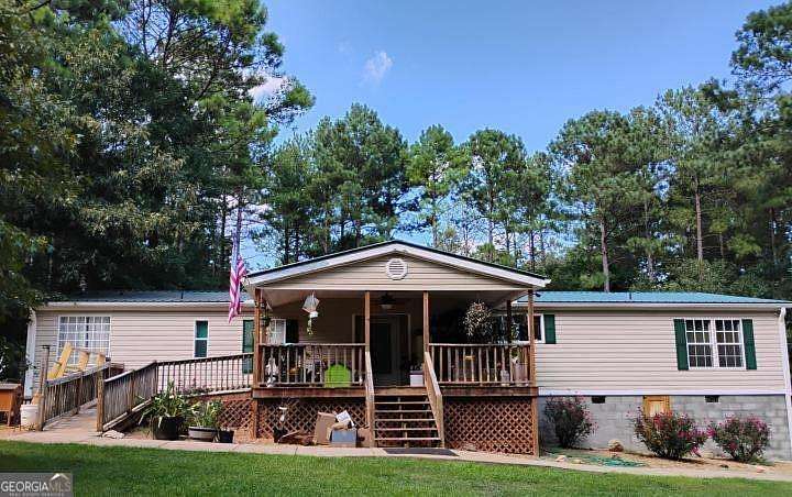 15.3 Acres of Land with Home for Sale in Dewy Rose, Georgia