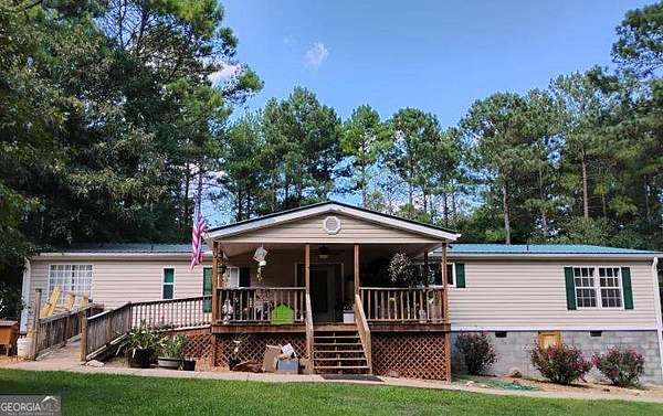 15.3 Acres of Land with Home for Sale in Dewy Rose, Georgia