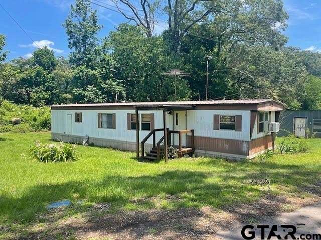 2.3 Acres of Residential Land with Home for Sale in Daingerfield, Texas