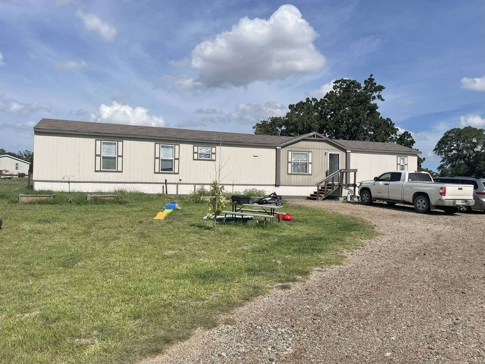 2 Acres of Residential Land with Home for Sale in Stockdale, Texas