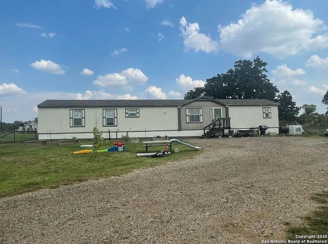 2 Acres of Residential Land with Home for Sale in Stockdale, Texas