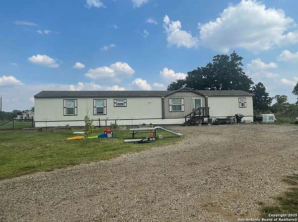 2 Acres of Residential Land with Home for Sale in Stockdale, Texas