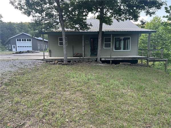 60 Acres of Agricultural Land with Home for Sale in Marble Falls Township, Arkansas