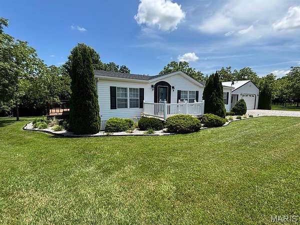 2.6 Acres of Residential Land with Home for Sale in Paris, Missouri