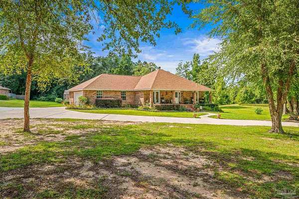 7.3 Acres of Residential Land with Home for Sale in Milton, Florida