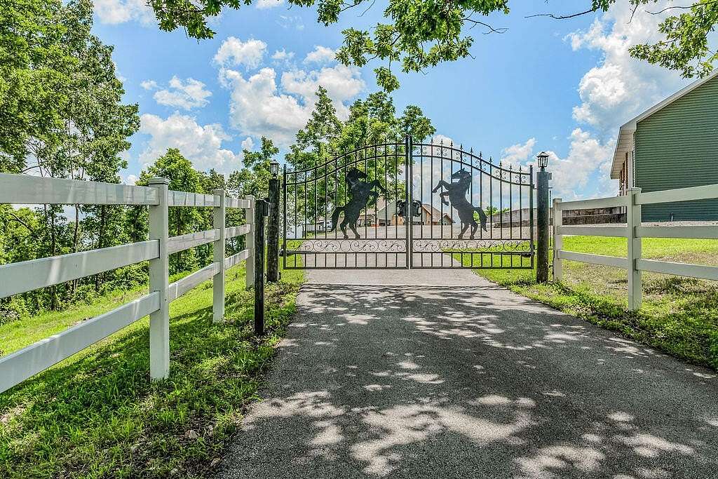 73.8 Acres of Land with Home for Sale in Cape Fair, Missouri