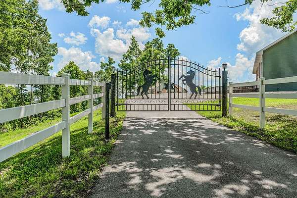 73.8 Acres of Land with Home for Sale in Cape Fair, Missouri