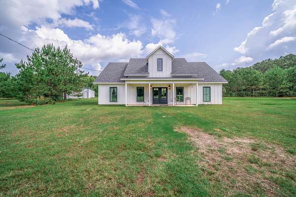 60.6 Acres of Recreational Land with Home for Sale in Carthage, Texas