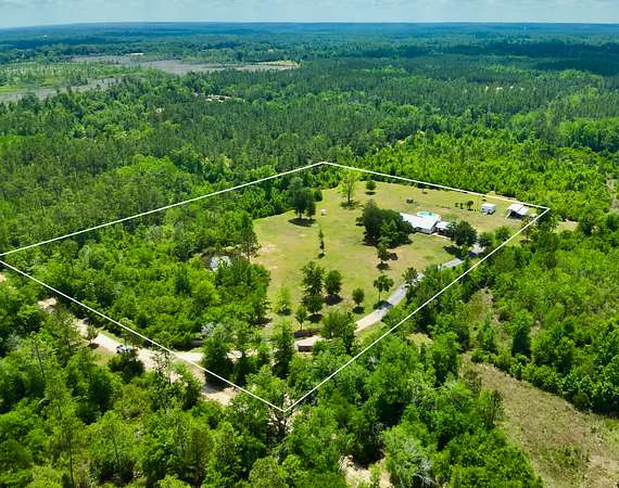 6.34 Acres of Land with Home for Sale in Cottondale, Florida