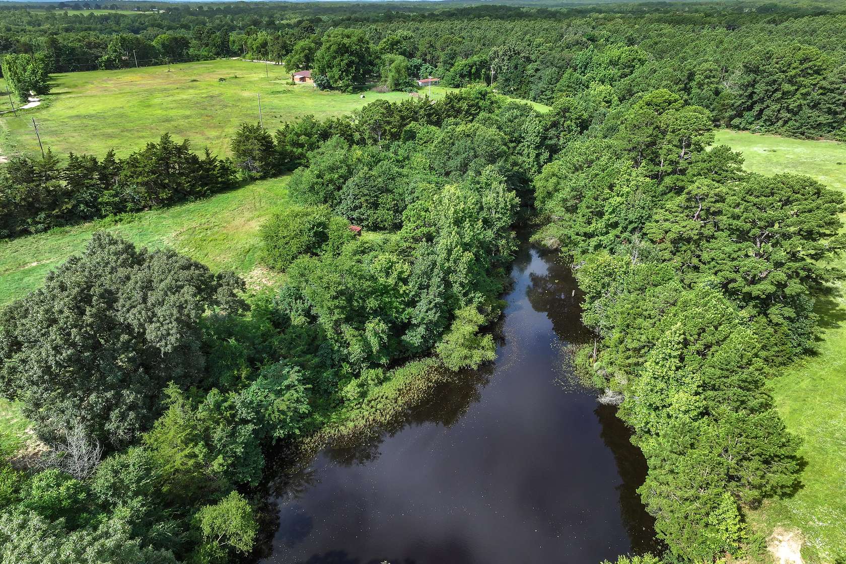 114 Acres of Land with Home for Sale in Scroggins, Texas