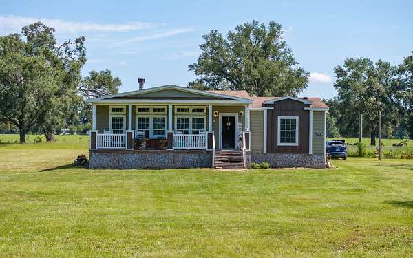 5.79 Acres of Residential Land with Home for Sale in McAlpin, Florida