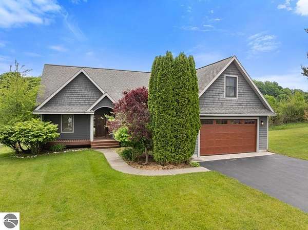 4.84 Acres of Residential Land with Home for Sale in Central Lake, Michigan