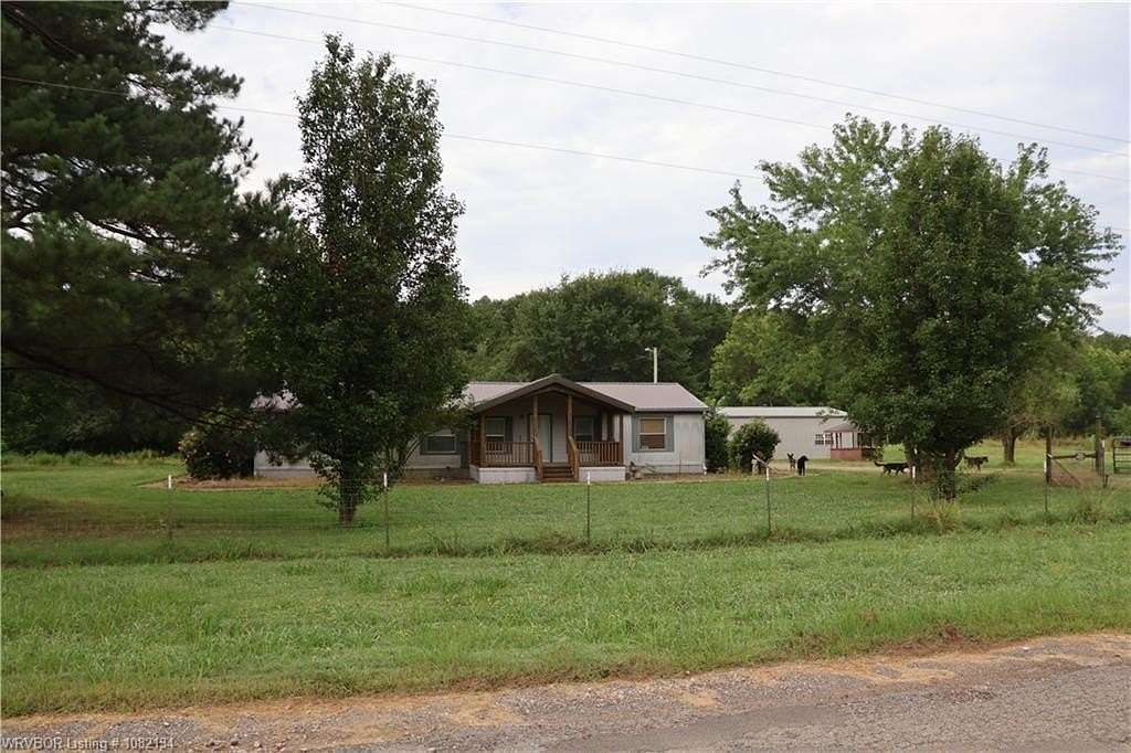 9.8 Acres of Land with Home for Sale in Heavener, Oklahoma