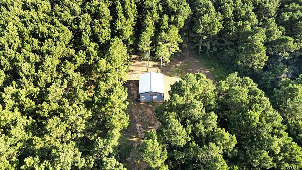 34.6 Acres of Recreational Land with Home for Sale in Troup, Texas