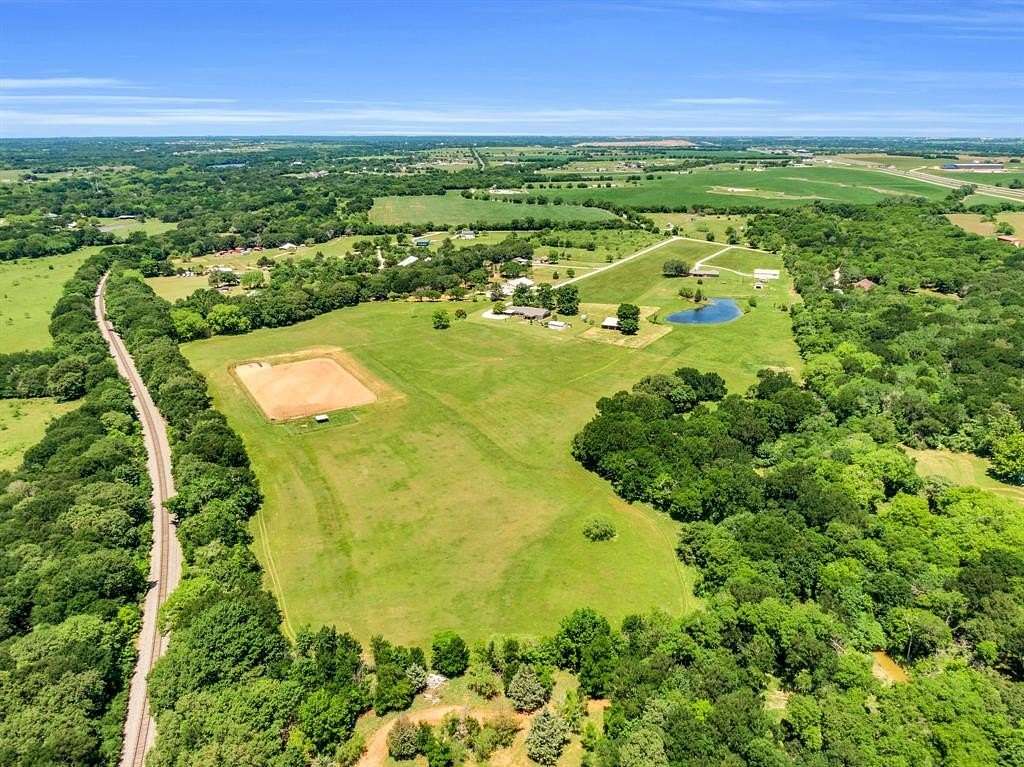 26.4 Acres of Land with Home for Sale in Grandview, Texas