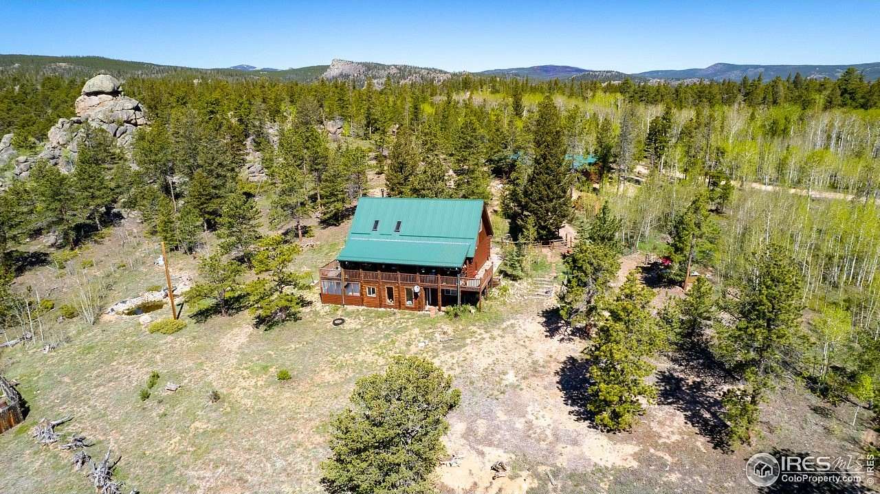 2.59 Acres of Residential Land with Home for Sale in Red Feather Lakes, Colorado