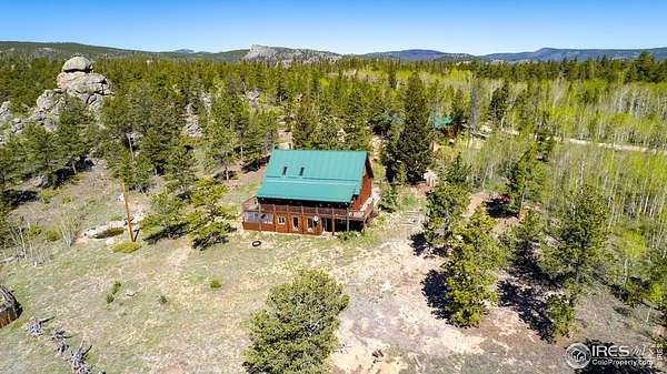 2.59 Acres of Residential Land with Home for Sale in Red Feather Lakes, Colorado