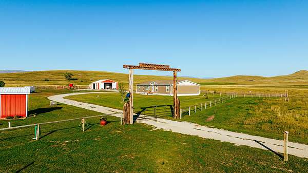 134 Acres of Agricultural Land with Home for Sale in Sheridan, Wyoming