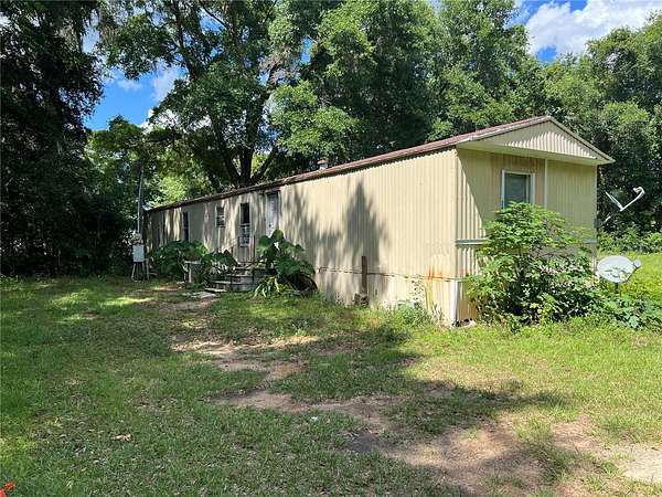 2.64 Acres of Residential Land with Home for Sale in Reddick, Florida
