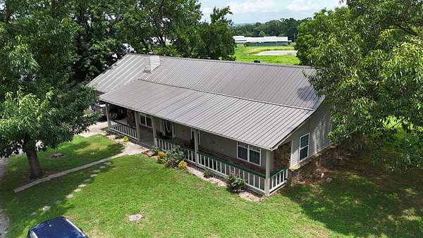 215 Acres of Land with Home for Sale in Paris, Arkansas