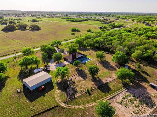 32.8 Acres of Agricultural Land with Home for Sale in La Vernia, Texas