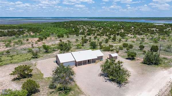 2 Acres of Residential Land with Home for Sale in Paint Rock, Texas