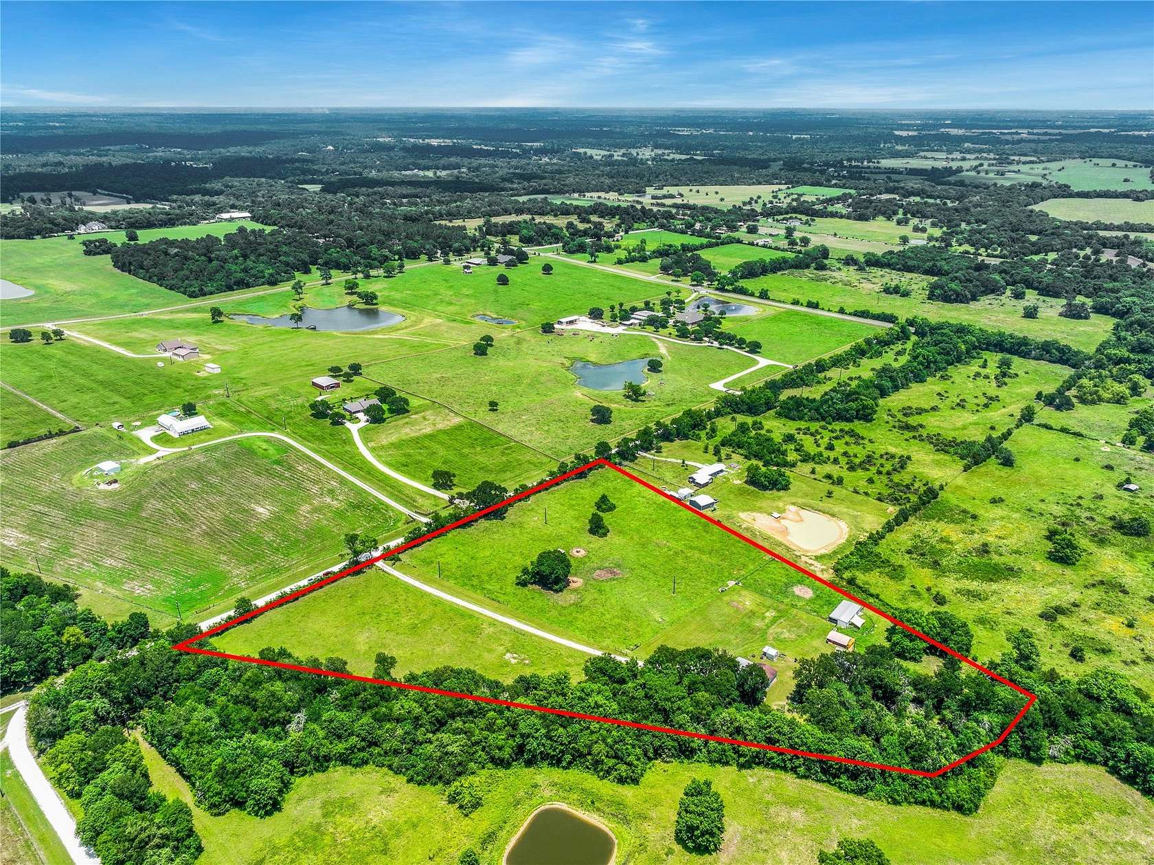 10 Acres of Land with Home for Sale in Plantersville, Texas