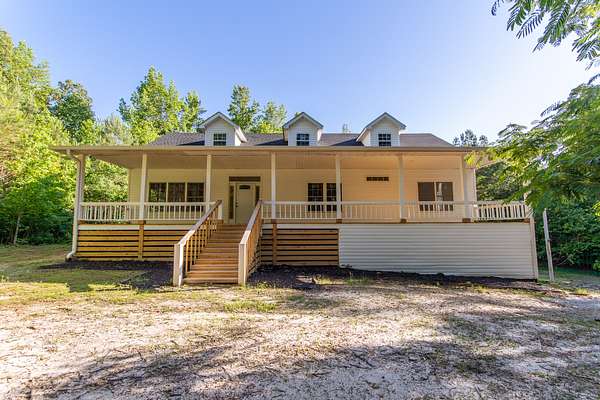 27.8 Acres of Recreational Land with Home for Sale in Holladay, Tennessee