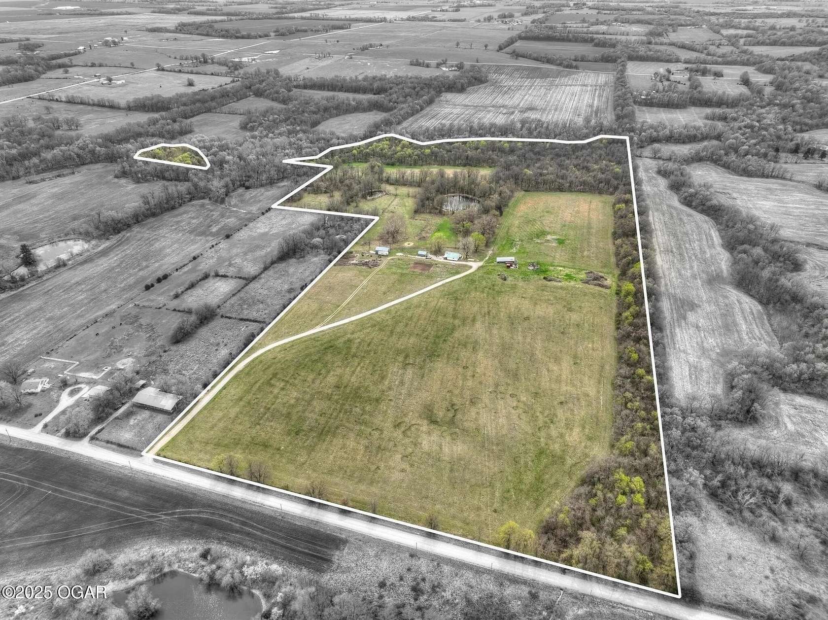 60 Acres of Agricultural Land with Home for Sale in Lamar, Missouri