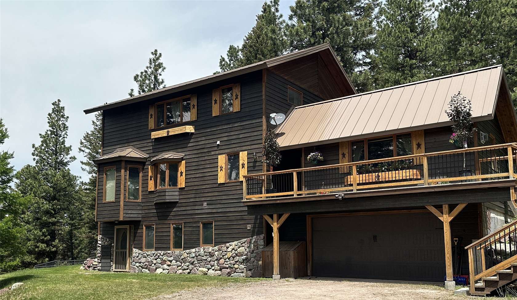 6 Acres of Residential Land with Home for Sale in Seeley Lake, Montana