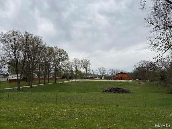 10 Acres of Residential Land with Home for Sale in Winfield, Missouri