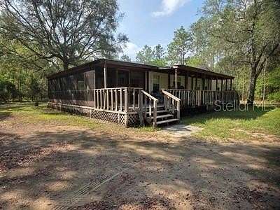 4.4 Acres of Residential Land with Home for Sale in Archer, Florida