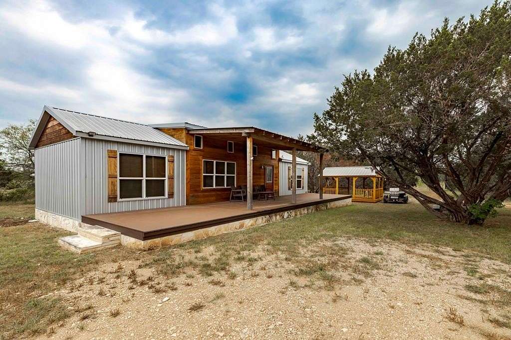 14.7 Acres of Land with Home for Sale in Center Point, Texas