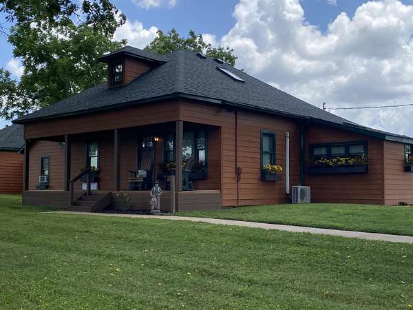 5 Acres of Residential Land with Home for Sale in Walnut Shade, Missouri