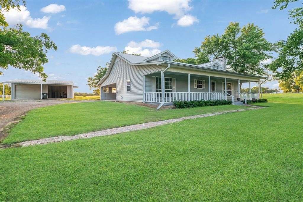 12.1 Acres of Land with Home for Sale in Paris, Texas