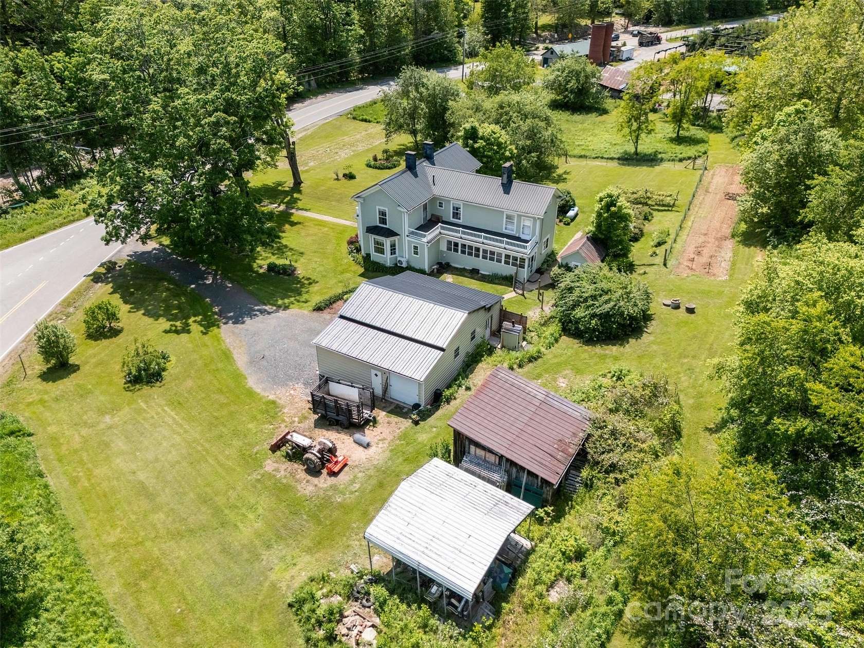 3.79 Acres of Residential Land with Home for Sale in Lansing, North Carolina