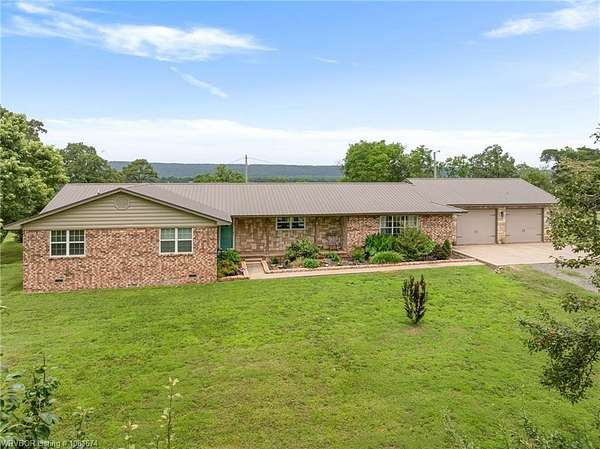 96 Acres of Agricultural Land with Home for Auction in Heavener, Oklahoma